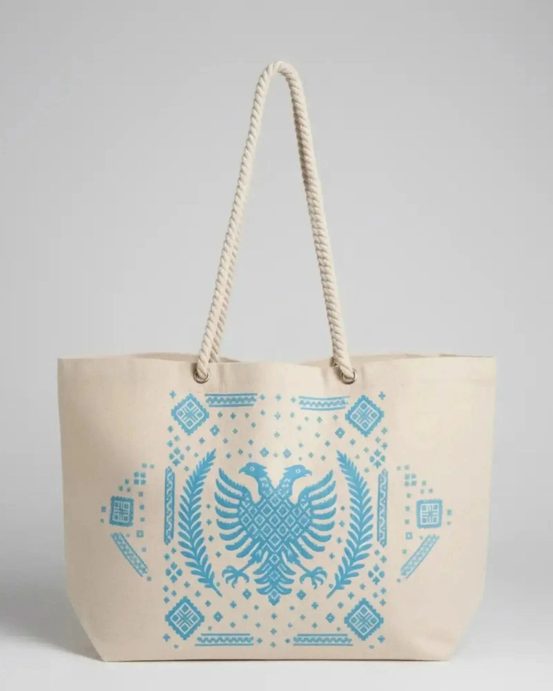 Ethno Jutetasche mit Doppeladler und Ornamentmuster in Türkis, mit Kordelhenkeln von vorn