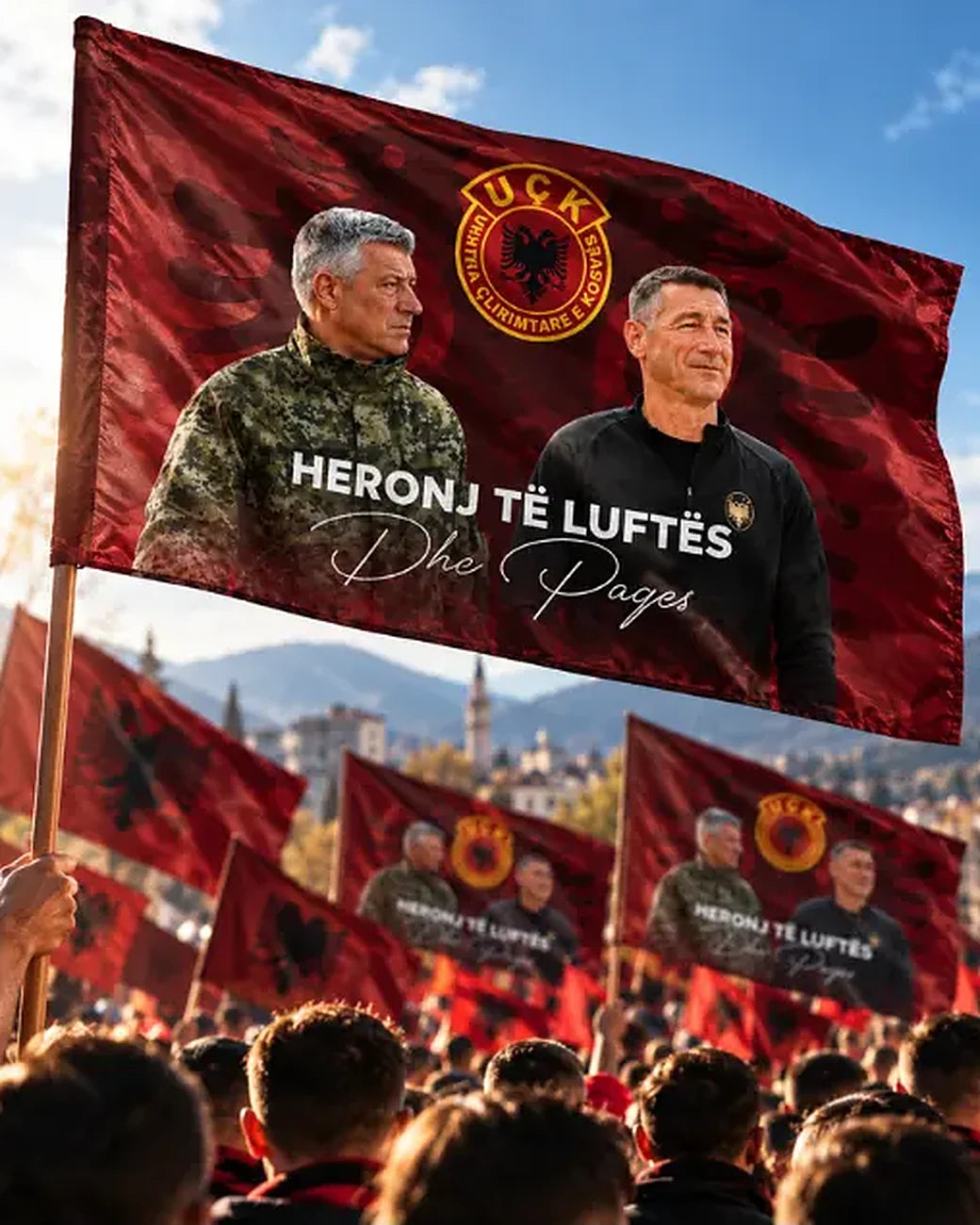 Heronj të Luftës flag being waved above the crowd at a rally