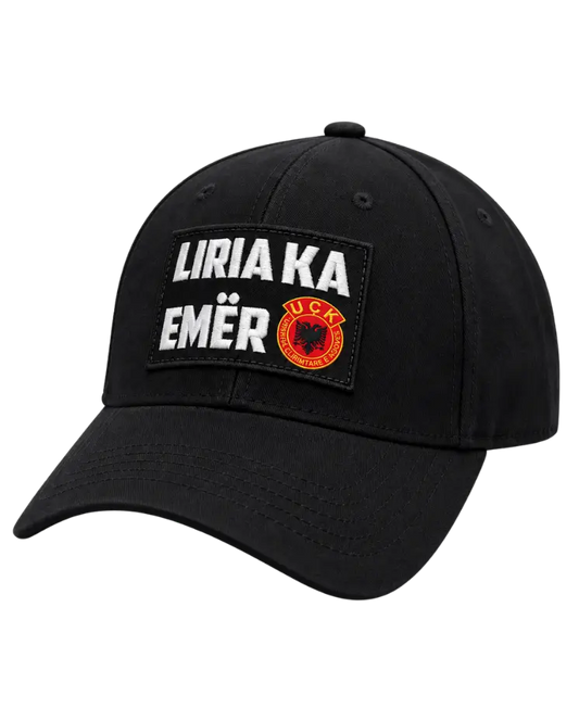 Black “Liria ka emër” baseball cap with UÇK emblem – side view showing the curved brim and six panels